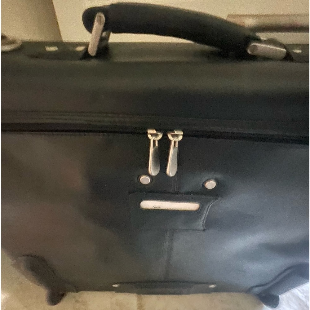 Large black luggage on wheels